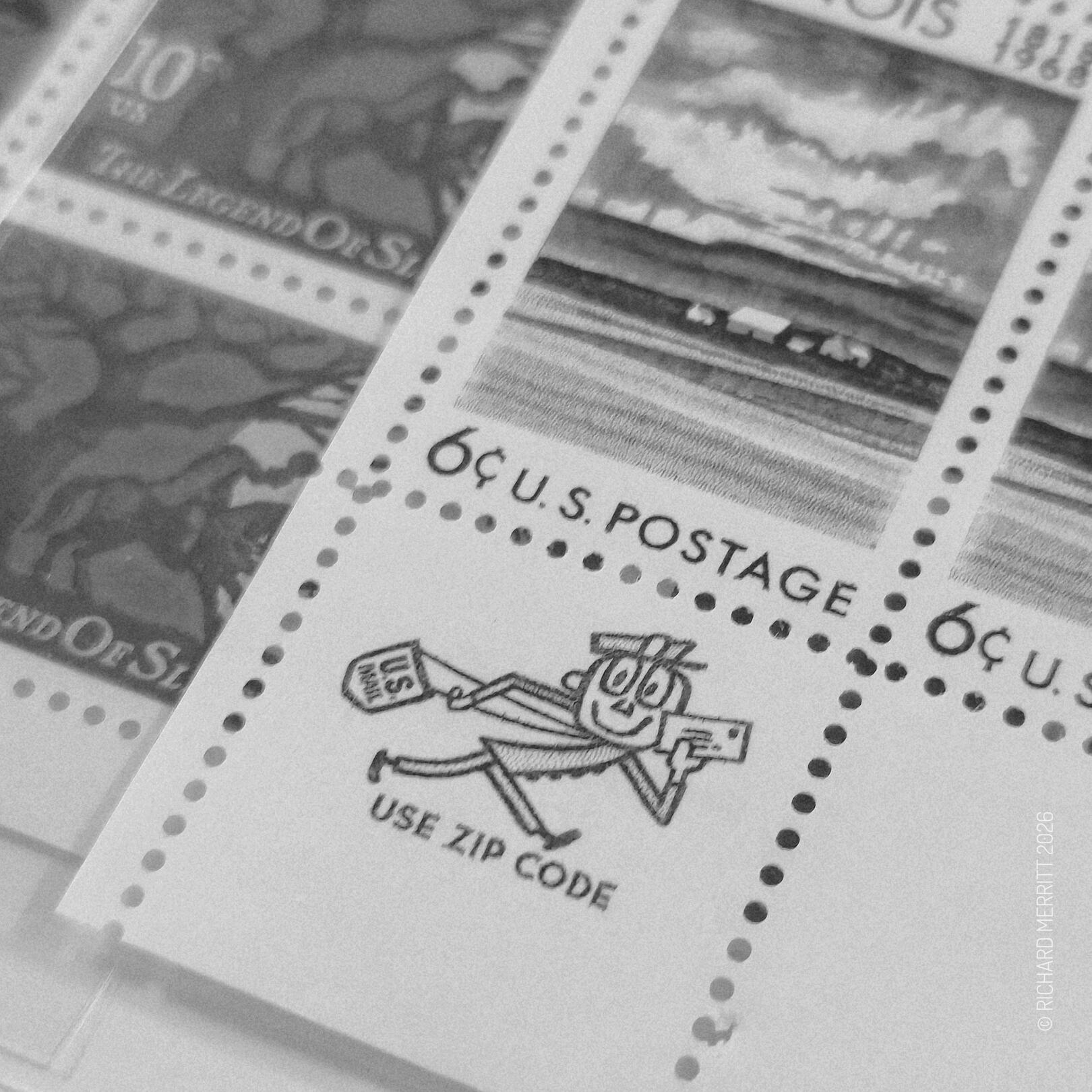 A close-up monochrome snapshot of Mr. Zip (USPS) on a vintage 1968 Illinois Statehood 6¢ US postage stamp full-sheet — archived by Richard Merritt / rchrdmrrtt.com